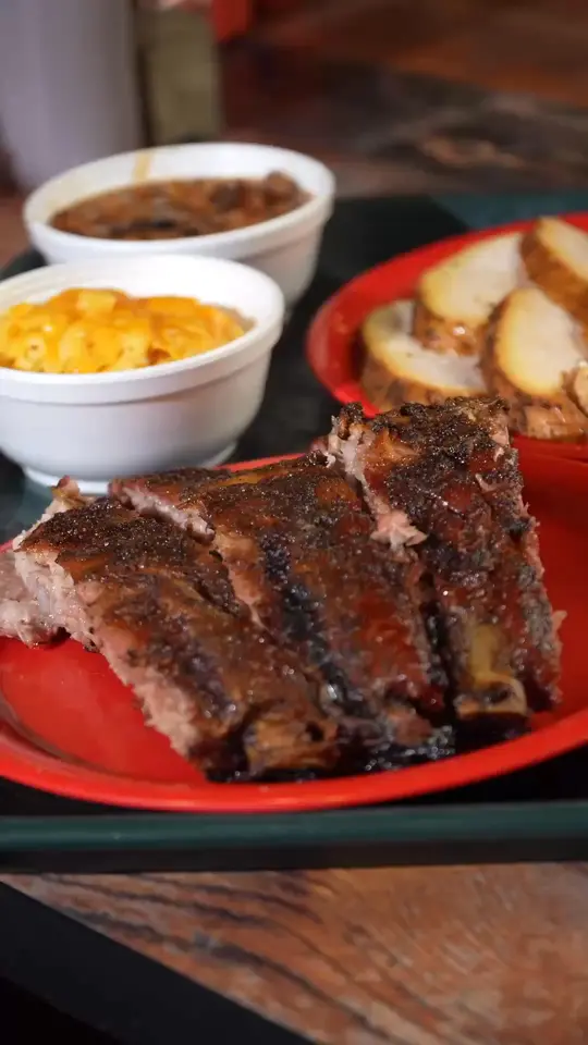 Hot Spot Barbecue in Pensacola showing restaurant, smoky meats, signature sauce, homemade sides, video by Hot Spot Barbecue on Facebook
