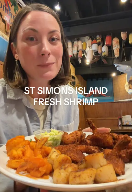 Iguanas Seafood Restaurant in St Simons Island showing food, buffalo shrimp, coconut shrimp, ice cream bar, atmosphere, family-friendly patio, video by her.atlas on TikTok
