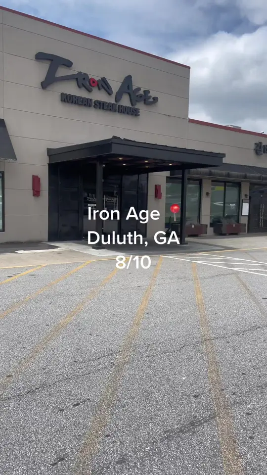 Iron Age Korean Steak House - Duluth in Duluth showing food, kimchi, rice cakes, video by kalzonee_e on TikTok