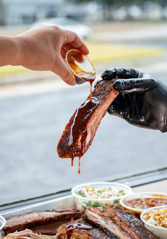 It's Different BBQ Company in Buford showing review, visit, to-go barbecue, proteins, gluten-free, dairy-free, video by cindyandpeti on TikTok
