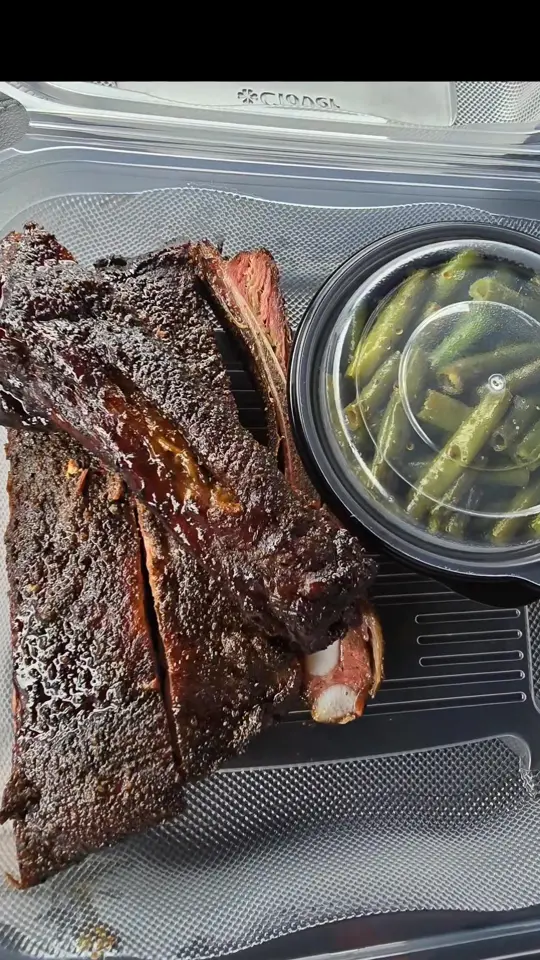 It's Different BBQ Company in Buford showing restaurant, brisket, turkey, ribs, green beans, mac and cheese, video by Roli Eats on Facebook