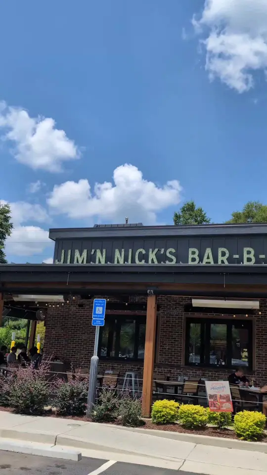 Jim 'N Nick's Bar-B-Q in Marietta showing review, visit, food, warm cheesy cornbread biscuits, video by adamwnelson on TikTok
