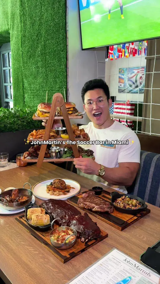 JOHNMARTIN's Restaurant & Bar in Coral Gables showing sports, soccer match / food, overtime tower / food, smash burgers / food, fish & chips / food, pastrami croquettes / food, osso bucco, video by zackaryeats on TikTok
