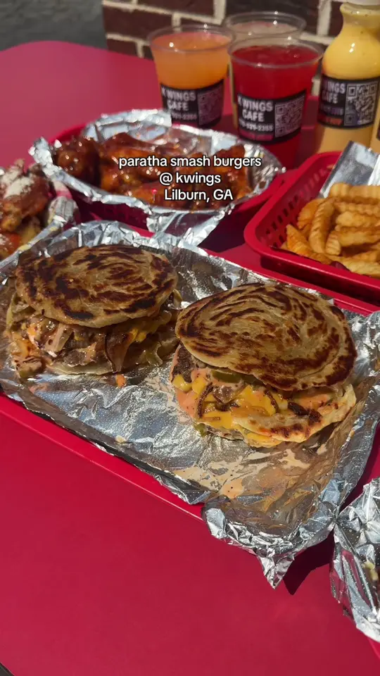 K Wings Cafe in Lilburn showing food, paratha smash burgers, video by charmed.eats on TikTok
