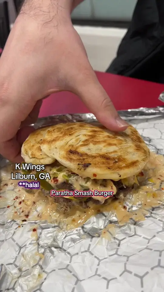 K Wings Cafe in Lilburn showing food review, paratha smash burger, wings, splash flavor wings, fries, philly cheesesteak, video by lifestylesdaily1 on TikTok
