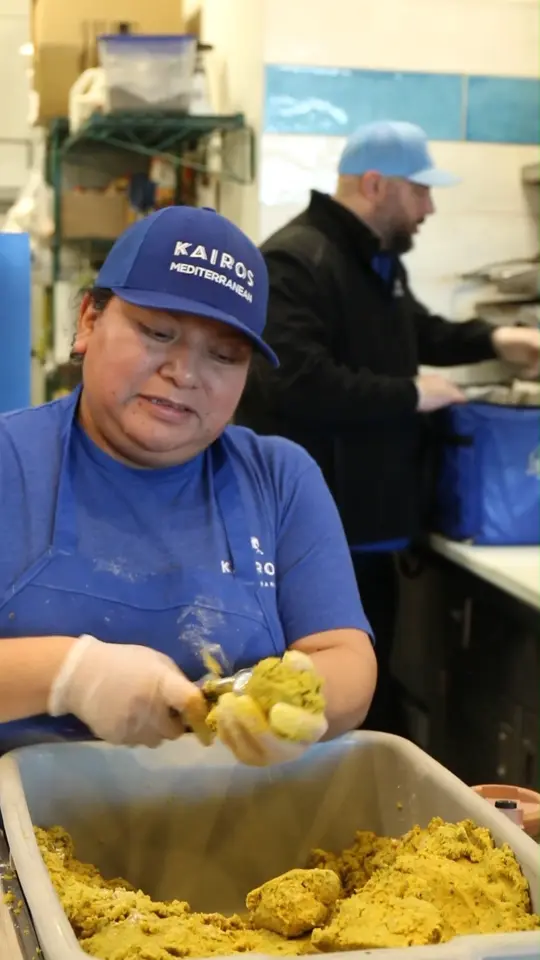 Kairos Mediterranean in Tallahassee showing behind the scenes, food preparation, cooking chicken, rolling falafel, chopping ingredients, video by Kairos Mediterranean - Mt Pleasant SC on Facebook