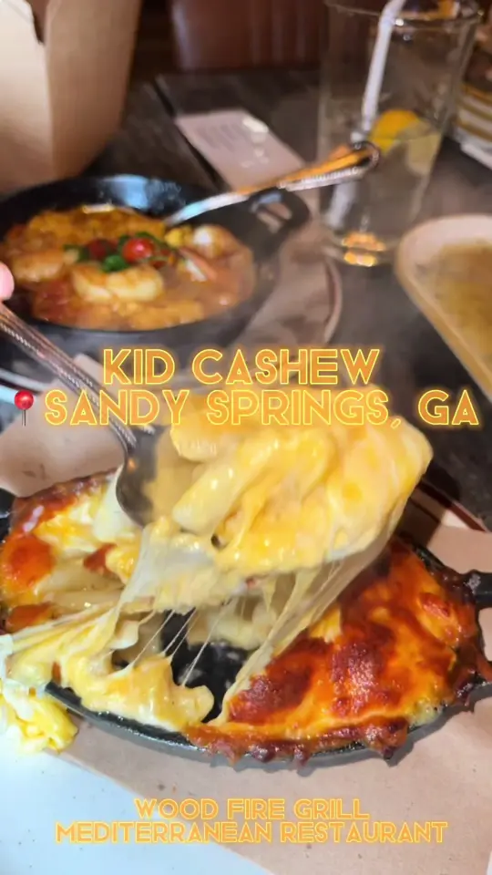 Kid Cashew in Sandy Springs showing restaurant visit, food review, spread trio, pita bread, wood fire octopus, lamb chops, sauteed shrimp & polenta, chicken skewers, lamb skewers, wild, video by twocentsliyah on TikTok