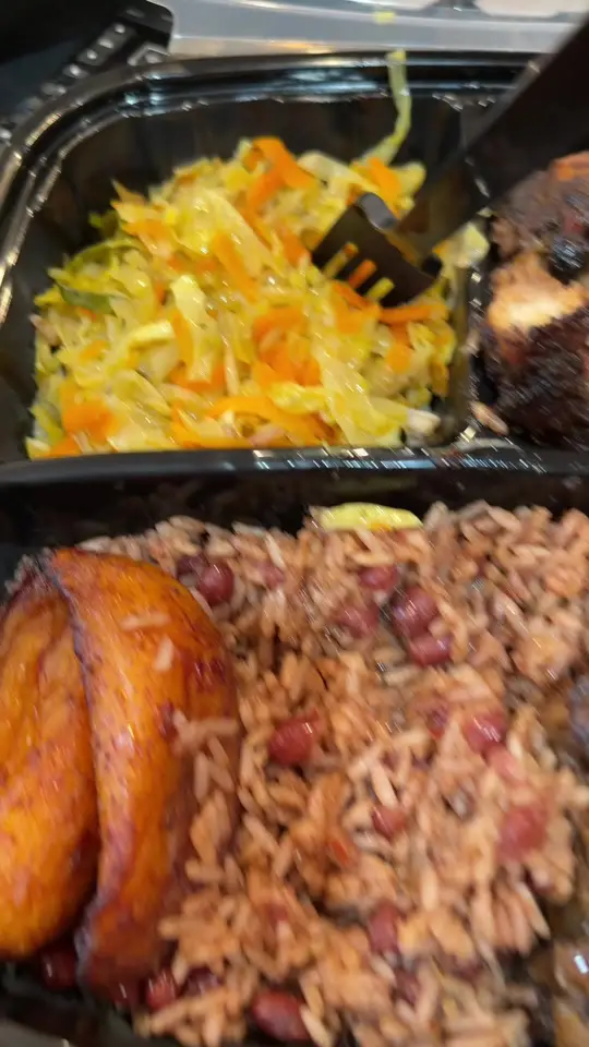 Kingston Grill in Forest Park showing food review, jerk chicken, rice and peas, cabbage, video by urbanbeautyming on TikTok