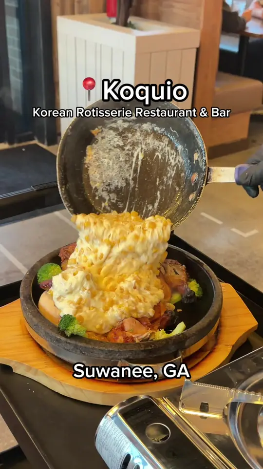 Koquio in Duluth showing rotisserie chicken with corn and cheese, roasted pork belly, kimchi fried rice, video by mis.shelly on TikTok