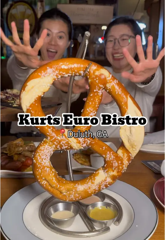 Kurt's Euro Bistro in Duluth showing homemade sausages, self-pour wine wall, schnitzel, currywurst, pork shank, bratwurst, video by atlanta_foodyyyyy on TikTok