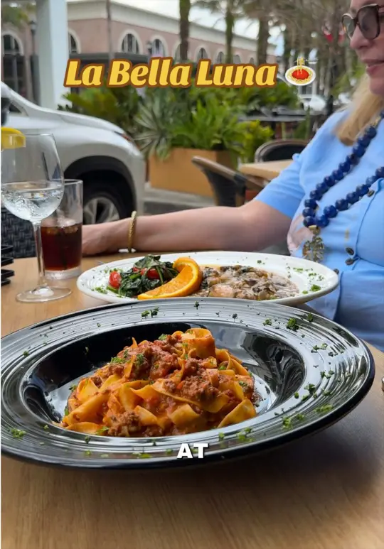 La Bella Luna in Orlando showing food, prosciutto & burrata, fried calamari, chicken marsala pappardelle bolognese, atmosphere, outdoor patio, video by foodie.girly on TikTok