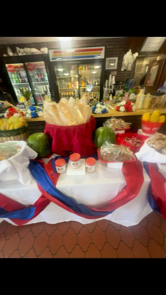 La Belle Creole Cuisine in Bunnell showing authentic haitian food, outside barbecue, bounce house for kids, fresh coconut and sugarcane, drinks from fun coast brewery, live music and vibes, video by Wisguere Dormevil on Facebook