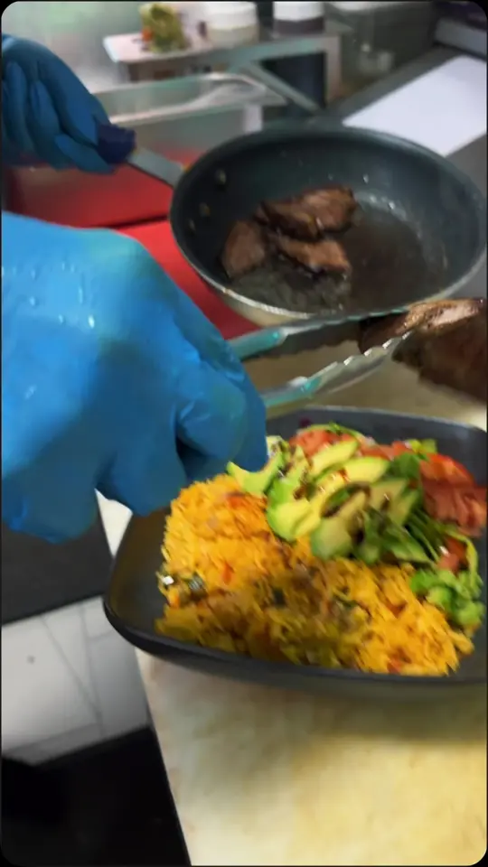 La Bottega Miami in Miami showing food, milanesa napolitana with papas, signature bowls (chimichurri steak, grilled chicken, salmon, milanesa), wraps, sandwiches, video by La Bottega Miami on Facebook