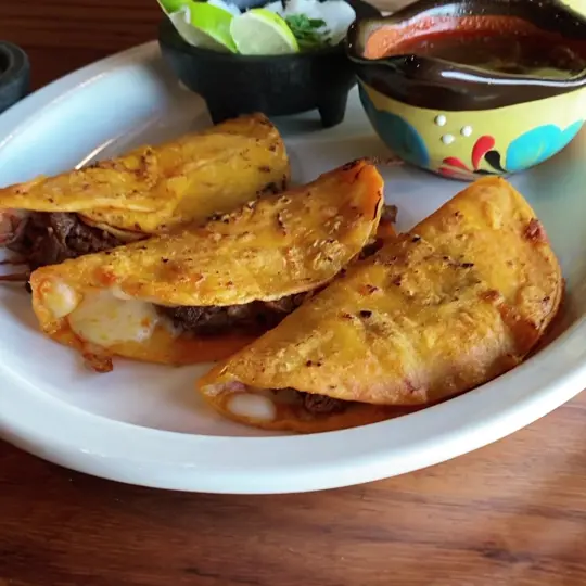 La Hacienda in Winter Park showing food, quesabirria, video by La Hacienda Restaurant on Facebook