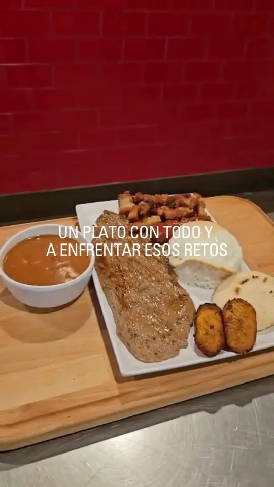  in Florida showing food, bandeja paisa, video by La Perrada Company on Facebook