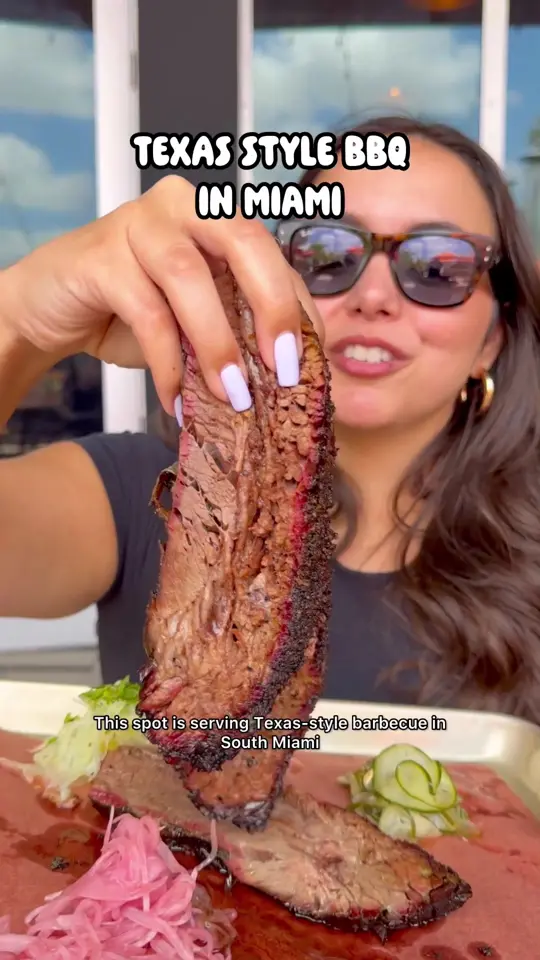 La Traila Barbecue in Miami showing food review, family platter, creamed corn, sweet potato cornbread, jalapeño mac & cheese, brisket elote, empanadas, video by iviethefoodie on TikTok