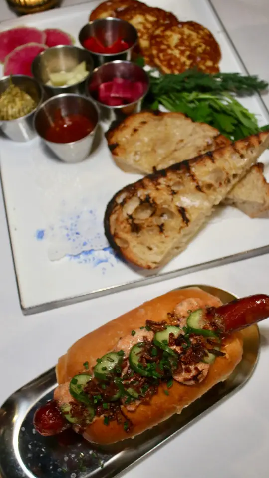 Last Dance in Avondale Estates showing review, contemporary american restaurant, disco ball, martini plate, bread service, fancy hot dogs, video by ATL Dessert Guide on Facebook