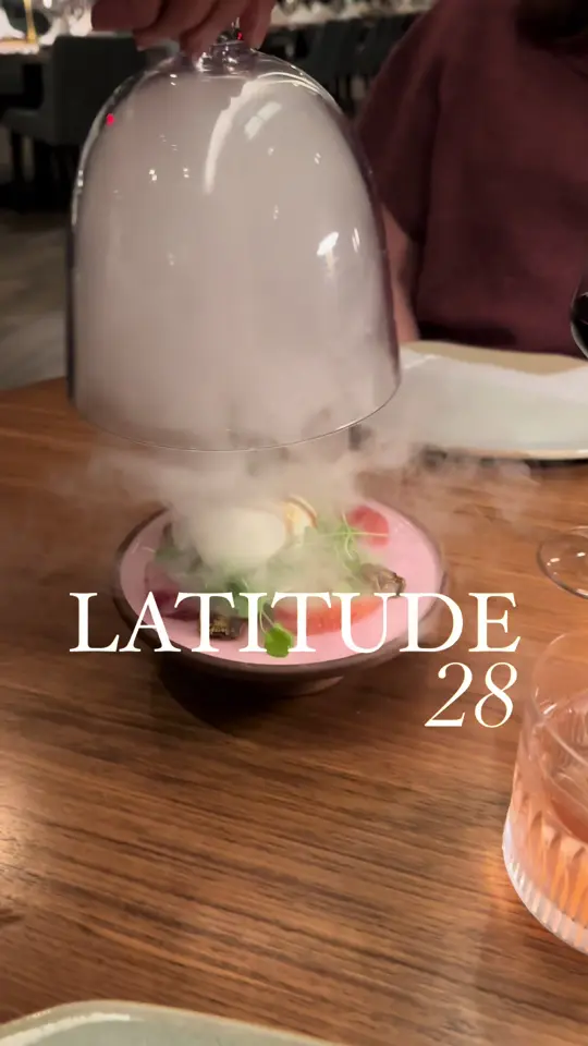 Latitude 28 in Clearwater Beach showing upscale dining, beachside atmosphere, craft cocktails, mediterranean coastal cuisine, video by thingstodotampabay on TikTok