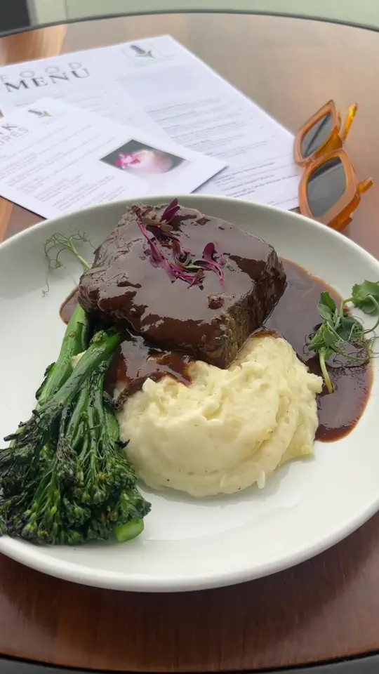 Lavender Rooftop Kitchen & Bar in Savannah showing short rib, drinks, rooftop views, video by dinnerwithericadanielle on TikTok