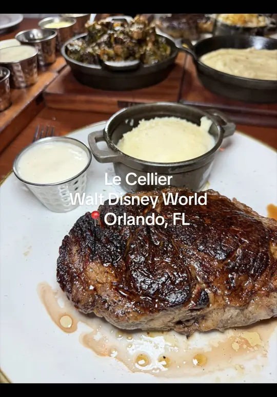 Le Cellier Steakhouse in Lake Buena Vista showing review, visit, steak, sauce flight, chardonnay truffle butter, video by michellemunches on TikTok