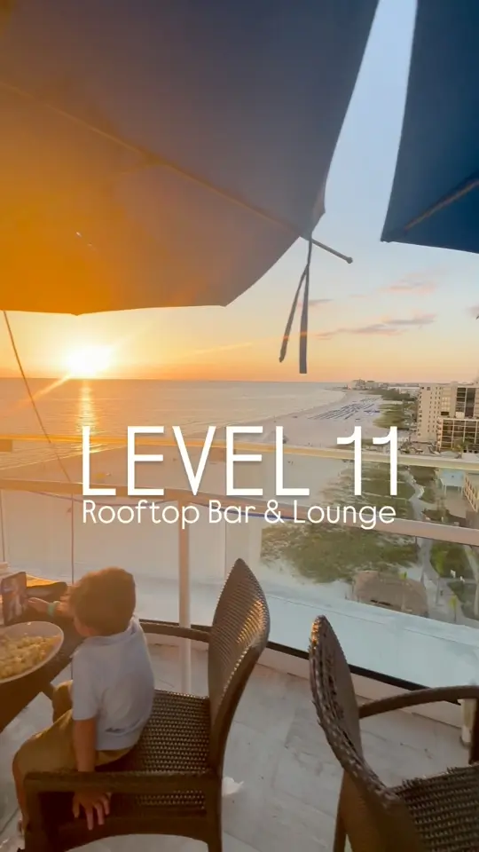 Level 11 Rooftop Bar & Lounge in St. Pete Beach showing cocktail, hand crafted cocktails / food, delicious small plates / atmosphere, panoramic views of the gulf of mexico / event, sunset, video by Things To Do Tampa Bay on Facebook