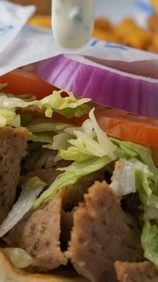 Little Greek Fresh Grill in Winter Garden showing food, gyro pita, chicken skewers, falafel, video by Little Greek Fresh Grill on Facebook