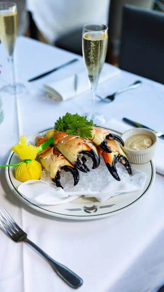  in Florida showing stone crab, restaurant visit, old-florida charm, sunset, gulf waters, local legend, video by Naples, Marco Island, Everglades - Parad on Facebook