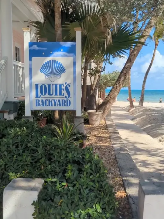 Louie's Backyard in Key West showing restaurant visit, tapas-style menu, florida keys seafood, stunning views, chef interaction, video by keywestfoodguide on TikTok