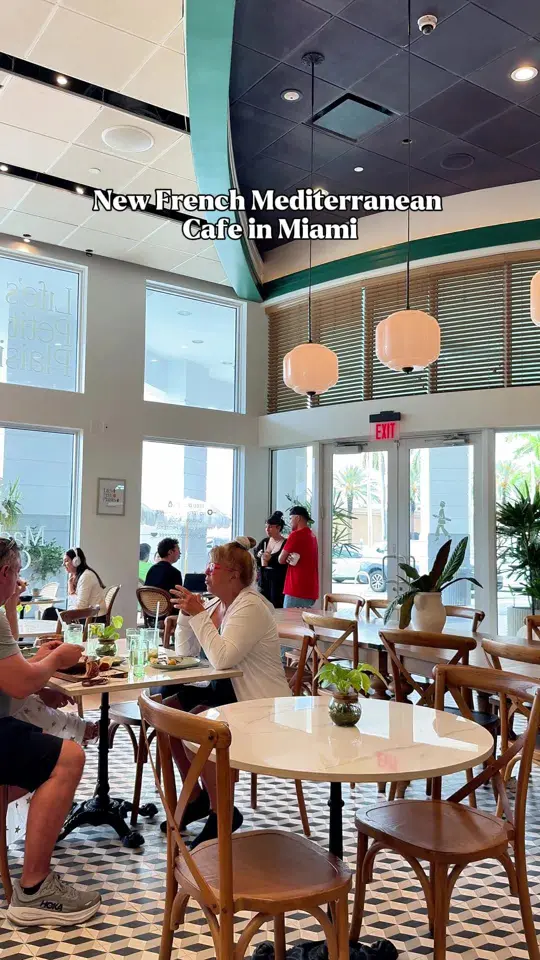 Madame Olivia North Miami in North Miami showing food, shakshuka, challah french toast, basque cheesecake, french-mediterranean café, video by miamifriendors on TikTok