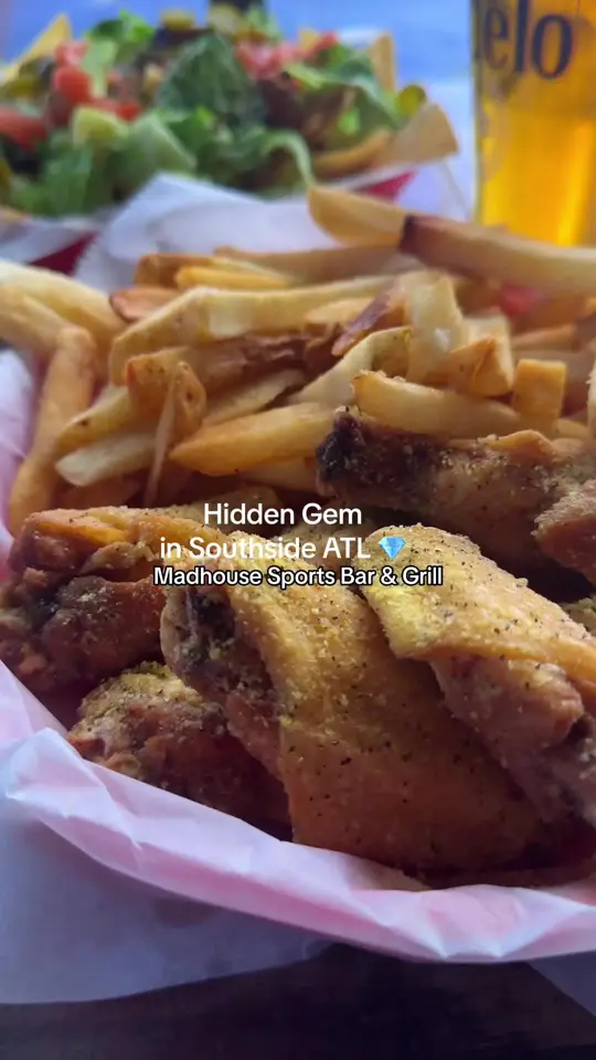 Madhouse Sports Bar & Grill in College Park showing drinks, wings, video by madhouseatl on TikTok