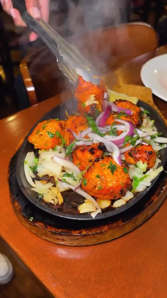 Maharaja Indian Cuisine in Sarasota showing food, chicken tikka, video by Maharaja Indian cuisine on Facebook