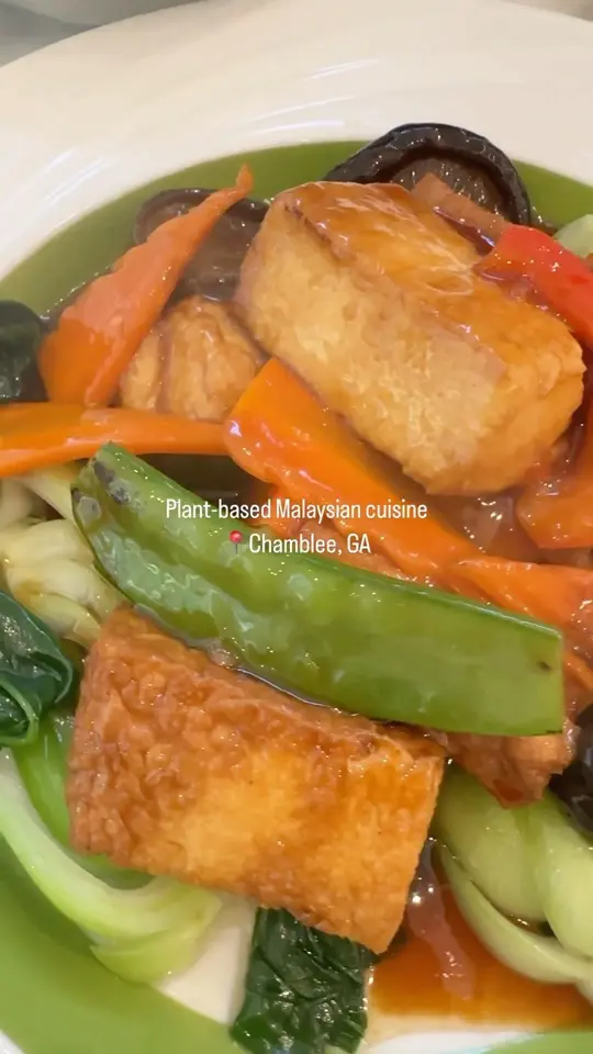 Mamak Vegan Kitchen in Chamblee showing restaurant visit, vegan food, video by Welcome to Atlanta's DeKalb County on Facebook