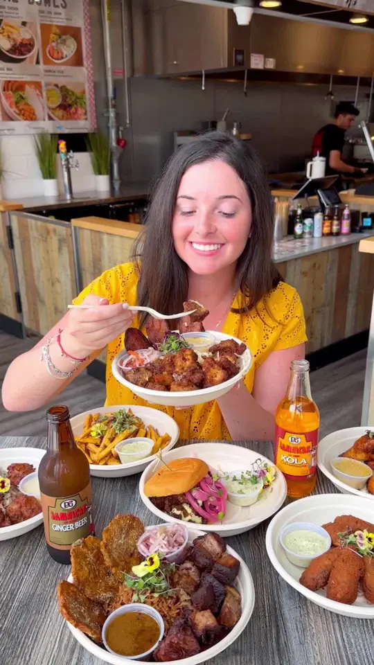 Manjay Restaurant in Miami showing caribbean food, jerk chicken, visit, video by treatyoselfeverywhere on TikTok