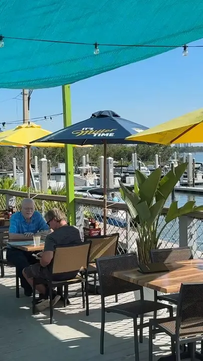 Marina Cantina Tin Tiki in Fort Myers Beach showing review, visit, waterfront views, food, drinks, margarita, video by Salty Sam's Marina on Facebook