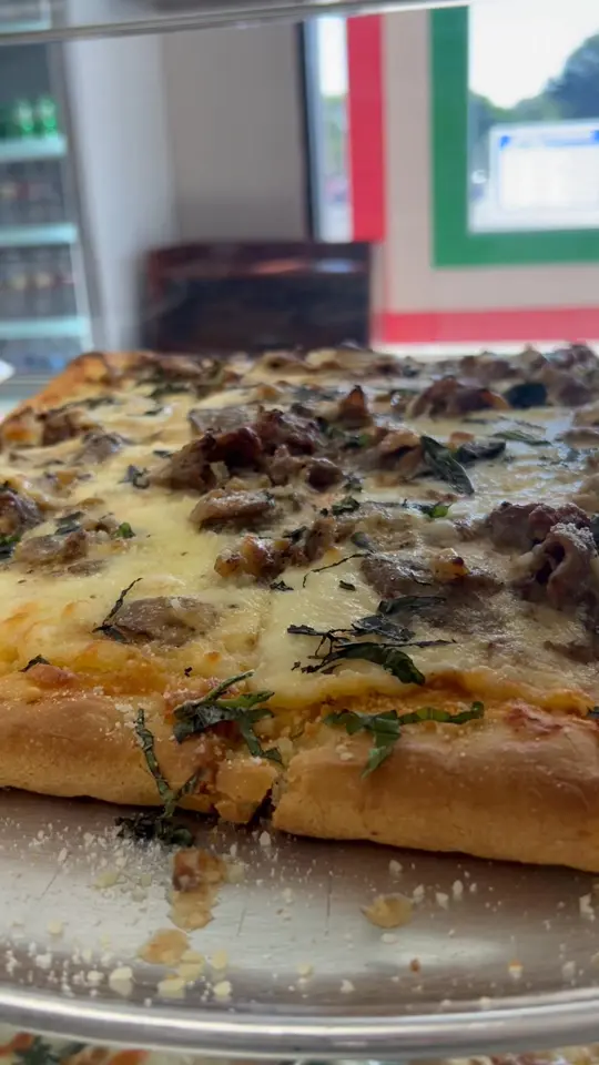 Mario's Pizza, Wings & Catering in Flowery Branch showing pizza, slice, video by Mario’s Pizza on Facebook
