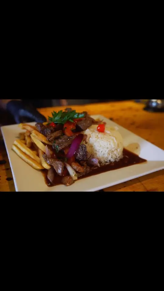 Martin Fierro Restaurant in Naples showing food, beef saltado, video by Martin Fierro Restaurant on Facebook