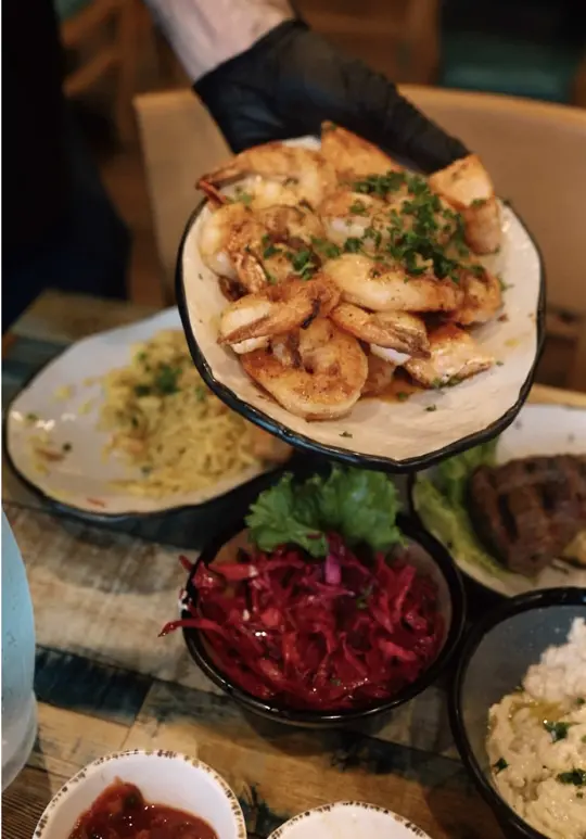 Mashawi Mediterranean in Roswell showing restaurant visit, all-you-can-eat dining, salads, dips, appetizers, grilled food, video by hotspotplugatl on TikTok