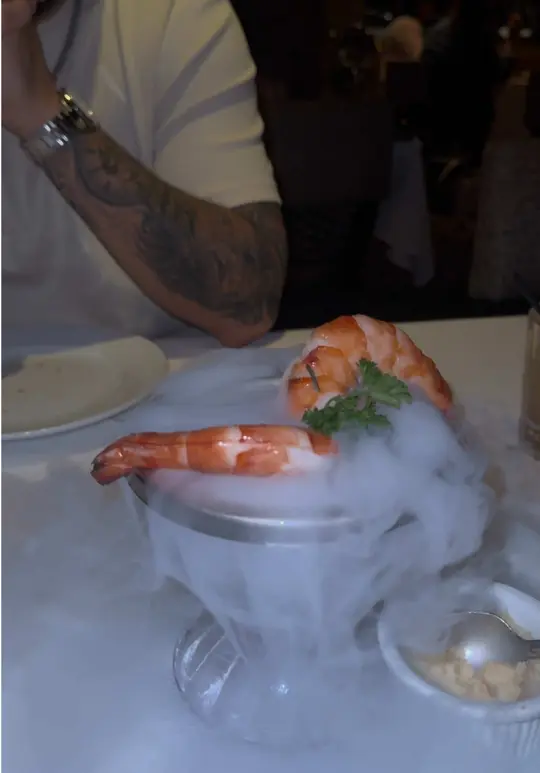 Mastro's Ocean Club in Miami showing review, 33 oz ribeye, white cheddar mac & cheese, creamed corn, asparagus, roasted brussels sprouts, wagyu bites, dream berry martini,, video by arielbuchholzz on TikTok