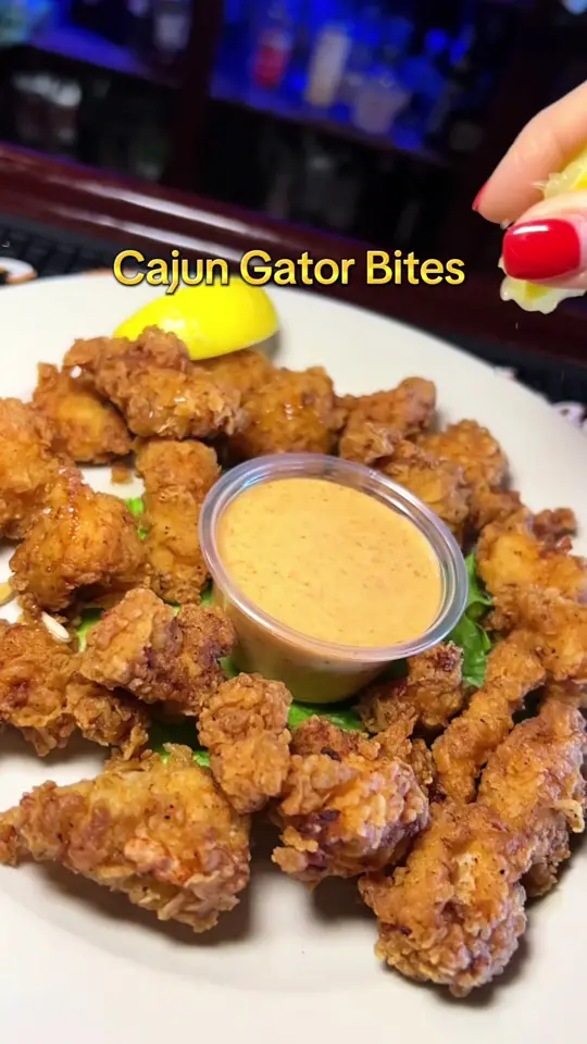 McKenna's Place in Palm Springs showing food, cajun gator bites, video by mckennasplacewestpalm on TikTok