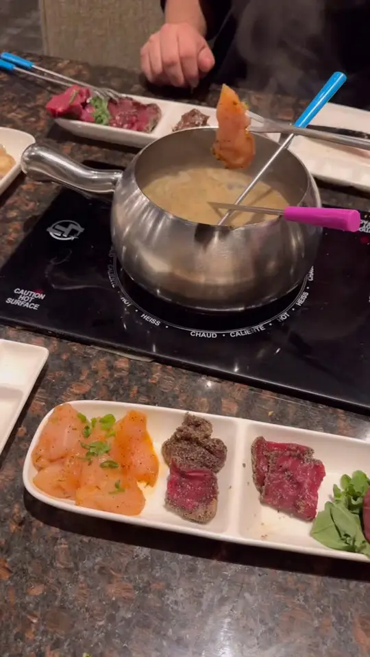 Melting Pot in Sarasota showing review, visit, interactive dining experience, 4-course meal, video by Wandercuse on Facebook