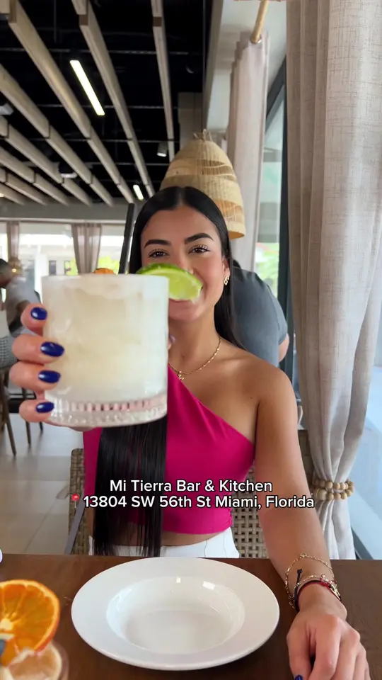 Mi Tierra Bar & Kitchen in Miami showing review, visit, empanada tacos, pastel d' yuca con cangrejo, mofongo coronao, tres golpes, sancocho, mi tierra cocktail, rum, video by gabrielaromeros on TikTok