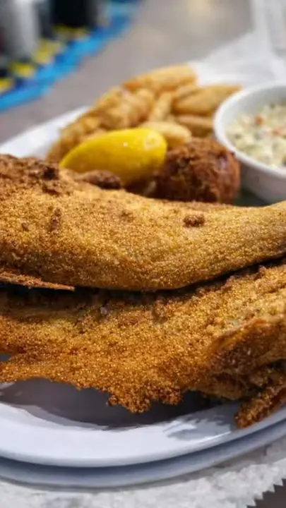 Mike's Seafood Market & Grill in Blairsville showing food, whole fried catfish, video by Mike's Seafood Market & Grill on Facebook