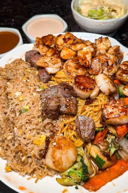 Mizu Japanese Steak House And Sushi in Kissimmee showing restaurant, hibachi, sushi, mizu supreme, krab rangoons, fried gyoza, mizu roll, video by orlandofoodfinders on TikTok