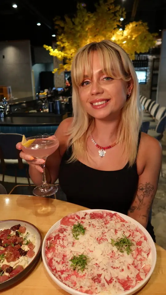 Mordisco Steakhouse in Orlando showing food, tuna ceviche, beef carpaccio, sweet plantains with cheese, mordisco platter, wood fired salmon, nutella brownie sundae, video by Katelyn Marie on Facebook