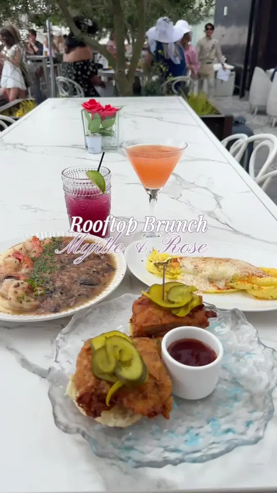 Myrtle & Rose Rooftop Bar in Savannah showing review, rooftop brunch, kentucky derby themed brunch, garden theme atmosphere, video by seeandsavorsavannah on TikTok