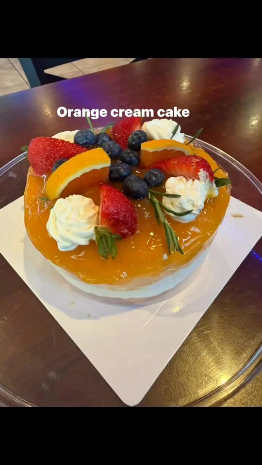 Nan's Thai Noodle in Port Charlotte showing food, orange cream cake, video by Nan's Thai Sweets on Facebook