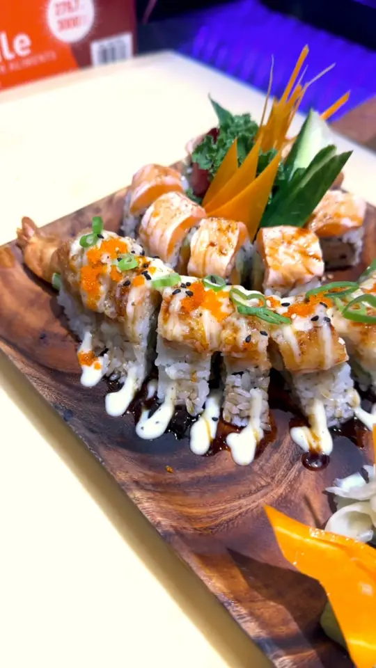 Nguyen’s Kitchen & Sushi Bar in Fort Myers showing double salmon roll, fort myers roll, video by Nguyen’s Kitchen/Sushi Bar on Facebook