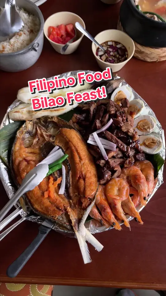  in Florida showing food, bilao meal, video by droolius on TikTok