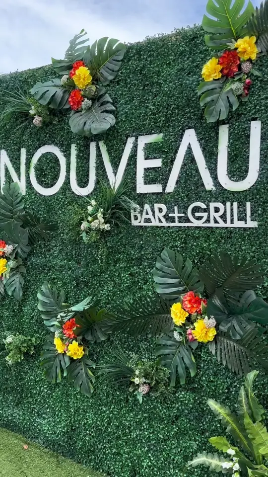 Nouveau Bar & Grill in College Park showing seafood & grits, crab cakes, honey wings with waffle fries, rooftop patio, plane watching, cocktail, video by ATL Airport District on Facebook