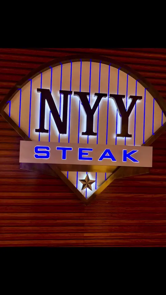 NYY Steak in Coconut Creek showing birthday dinner, shrimp cocktail, french onion soup, bacon, filet mignon, garlic mashed potatoes, cream corn, asparagus, ice cream sandwich, wine, video by roreykg on TikTok